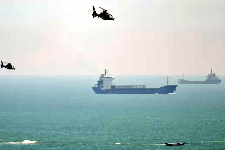 Chinese military helicopters fly past Pingtan island, one of mainland China’s closest points to Taiwan