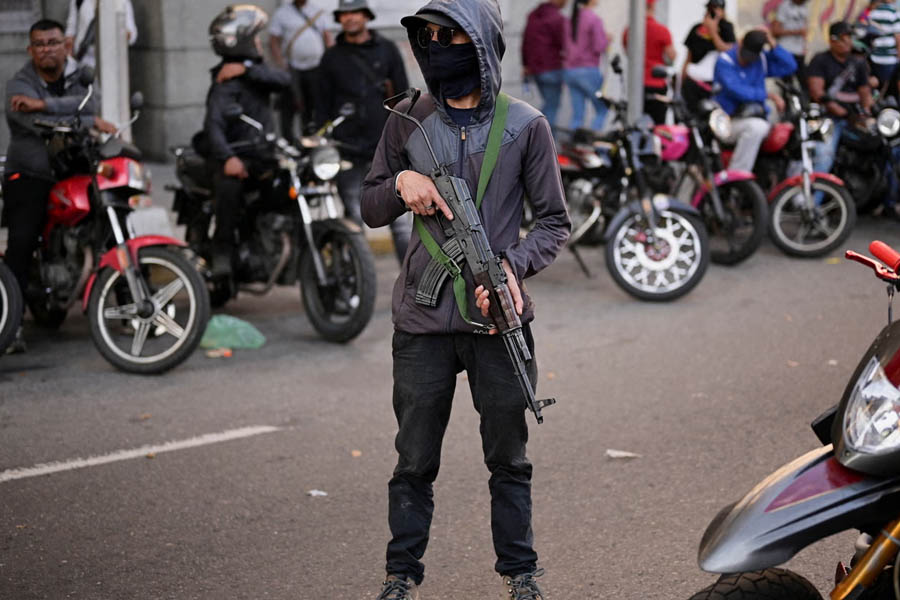 Armed colectivo member participating in a pro-Maduro demonstration in Caracas, Venezuela, amid ongoing political unrest.