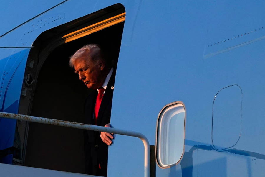 Donald Trump disembarking from Air Force One at Palm Beach International Airport in West Palm Beach, Florida, on 13 February.