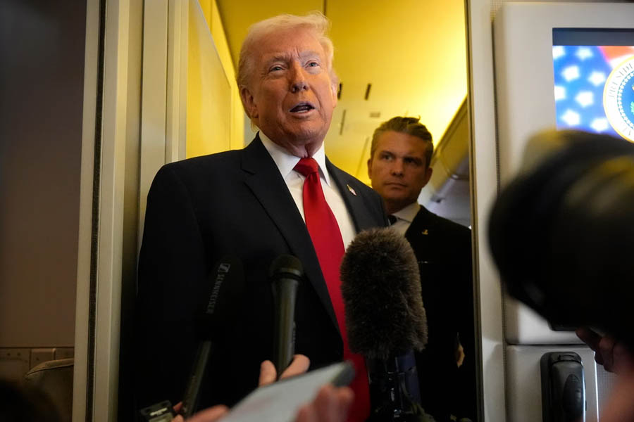 Donald Trump and Pete Hegseth aboard Air Force One flying from Dover Air Force Base in Delaware to Miami discussing U.S. military strategy during the Iran war.
