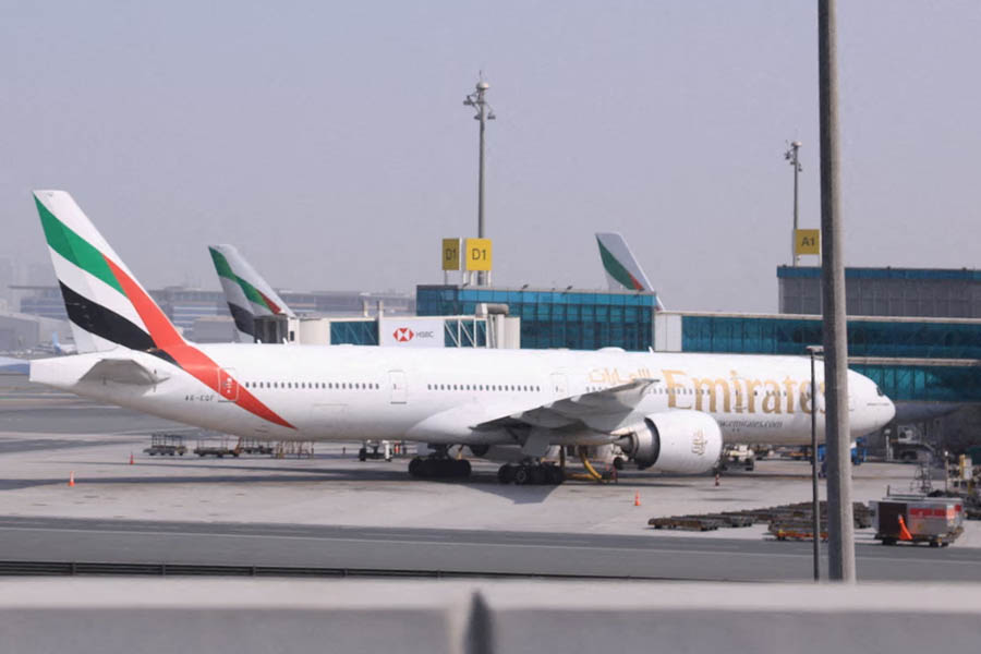 An Emirates passenger plane parked at Dubai International Airport while select flights are allowed to depart during the ongoing US-Israel war involving Iran.