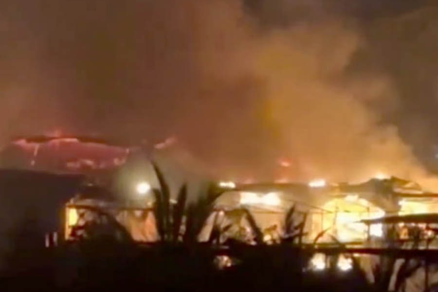 Firefighters and emergency personnel respond to a major fire at a crowded nightclub in Goa, India, where at least 23 people were reported dead.