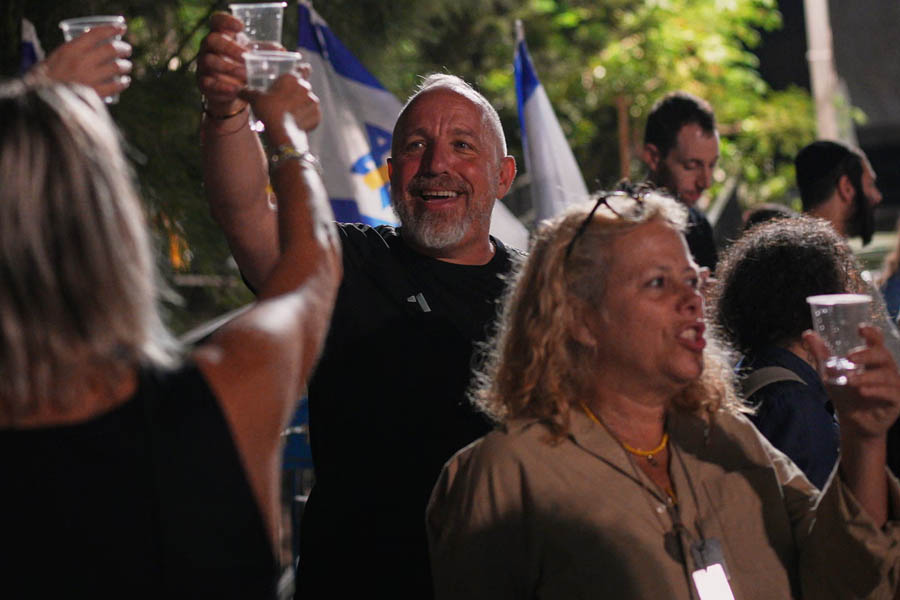Families and supporters of Israeli hostages held by Hamas celebrate in Hostages Square, Tel Aviv, after the first-phase Gaza ceasefire deal was announced.