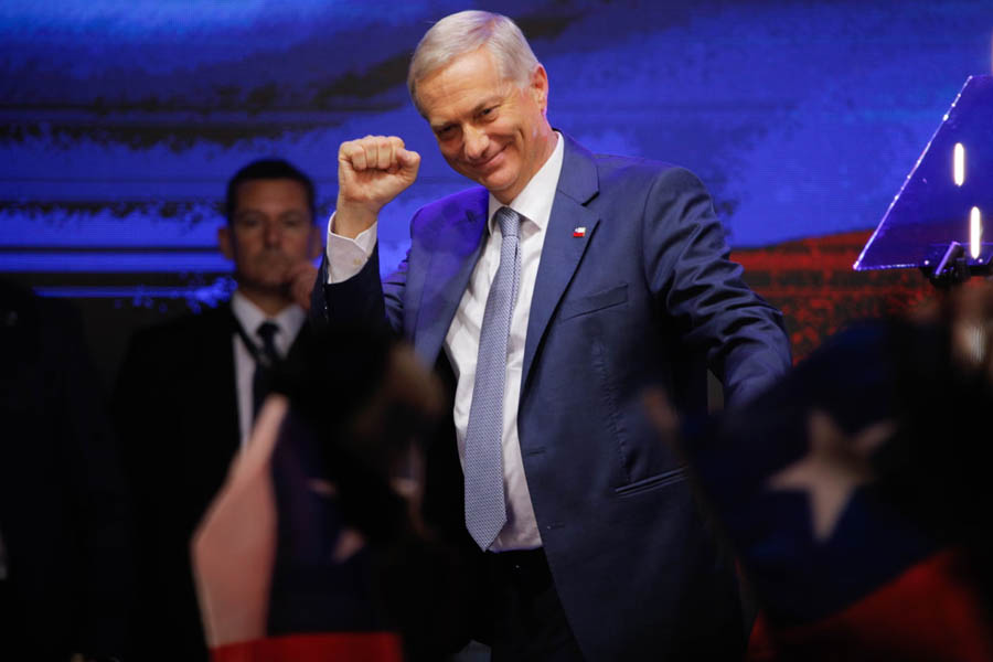 José Antonio Kast celebrates and greets a supporter after winning Chile’s presidential election in Santiago on December 14, 2025.