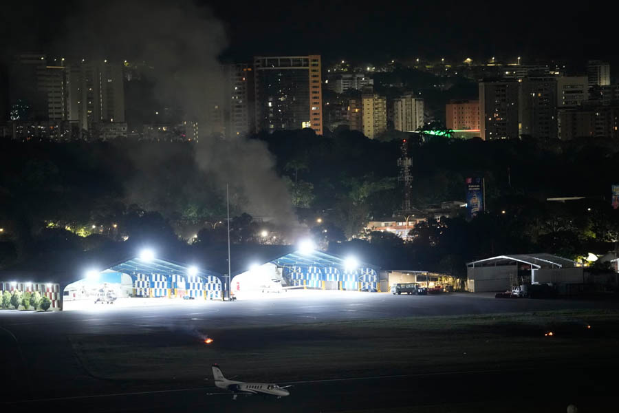 Smoke rising from La Carlota airport in Caracas, Venezuela, after explosions and reports of low-flying aircraft during a major military strike.
