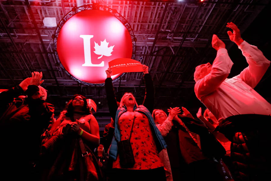 Supporters of Canada's Prime Minister Mark Carney react to polling numbers at the Liberal party election night headquarters in Ottawa, Ontario, Canada.