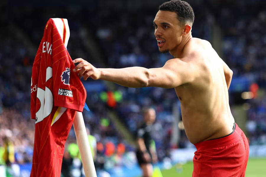 Trent Alexander-Arnold puts his shirt on the corner flag after scoring what proved the winner for Liverpool.