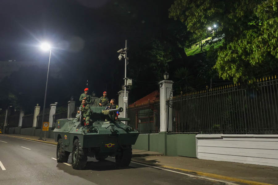 Military personnel guarding the Miraflores presidential palace in Caracas, Venezuela, amid heightened security following a reported US-led attack.