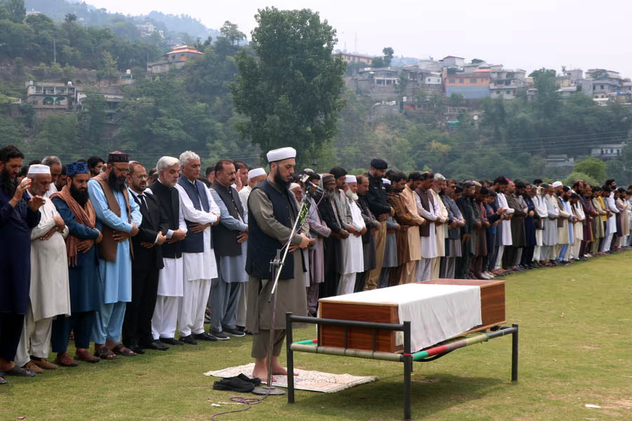 People attend the funeral of Kashmiri man Muhammad Yaqoob, who was killed after an Indian missile strike in Muzaffarabad, the capital of Pakistani administered Kashmir.