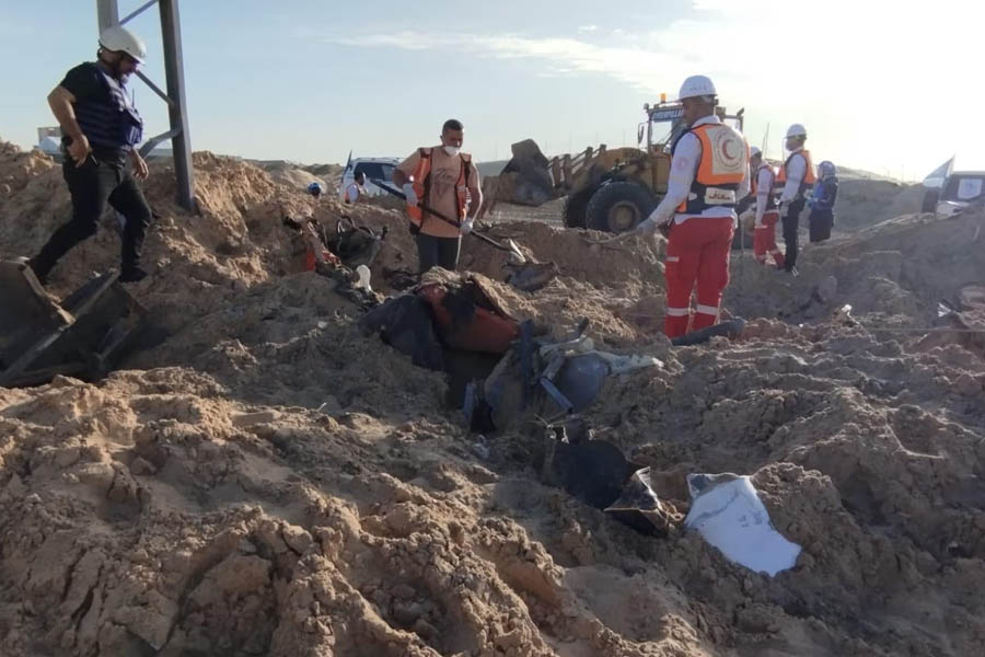 A Palestine Red Crescent Society team at the site of the attack.