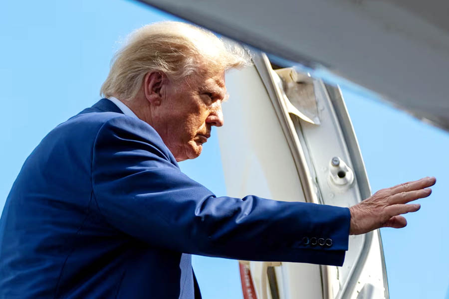 Donald Trump boards his personal plane at Miami International Airport.