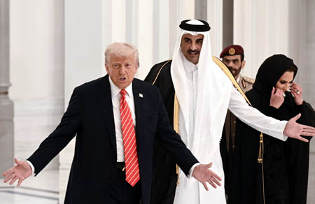 Qatar's emir Sheikh Tamim bin Hamad al-Thani greets Donald Trump in Doha on 14 May 2025.