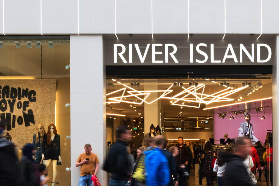 River Island will close 33 stores, risking hundreds of jobs, due to rising costs and a shift to online shopping.