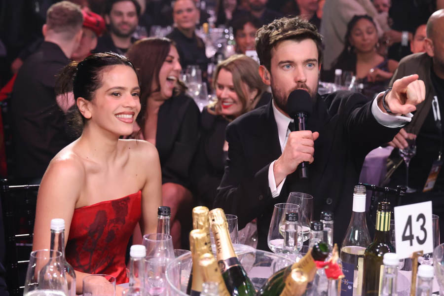 Rosalía posing with host Jack Whitehall after winning International Artist of the Year at the Brit Awards 2026 ceremony in Manchester.