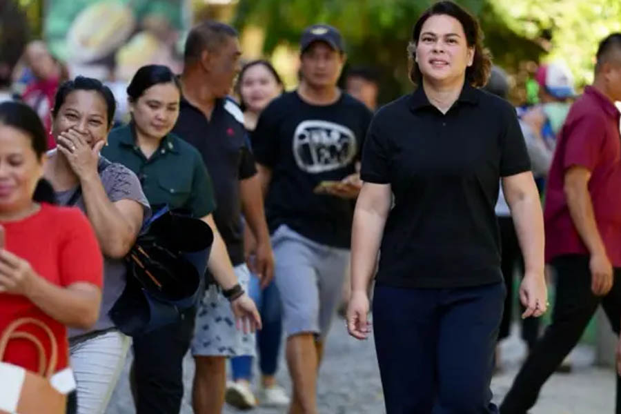 Sara Duterte greets supporters at polling station May 12, 2025.