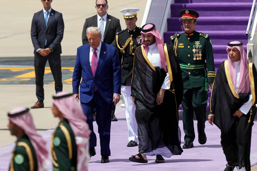 President Donald Trump walks with Saudi Crown Prince Mohammed bin Salman during an arrival ceremony at the Royal Terminal of King Khalid International Airport in Riyadh, Saudi Arabia.