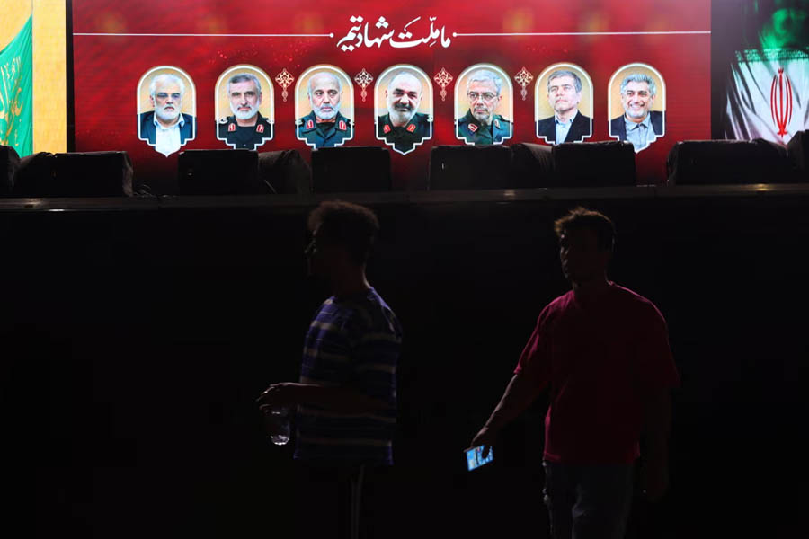 Pictures of those killed in Israeli strikes on Iran are displayed on a street in Tehran, Iran,13 June 2025.