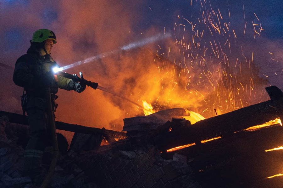 A firefighter works at the site of a Russian drone strike in the Sumy region of Ukraine.