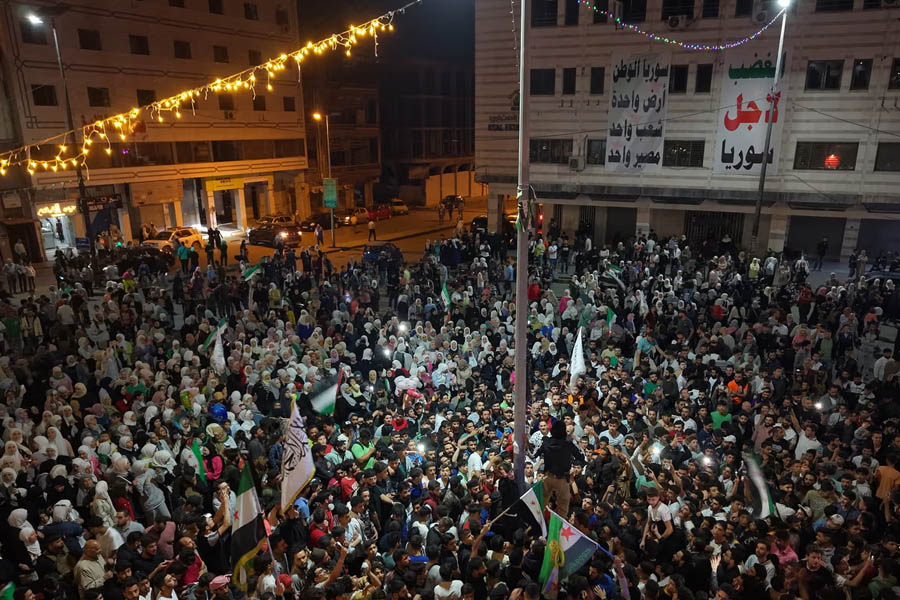 Syrians gather in Homs to celebrate after Trump announces he will lift all US sanctions on the country.