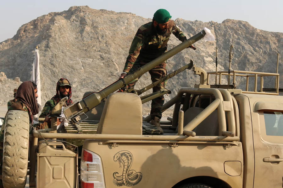Taliban soldiers preparing a rocket launcher on a vehicle near the Torkham border area after cross-border clashes between Pakistan and Afghanistan forces.