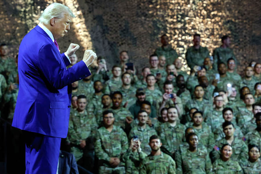 Donald Trump gestures while delivering remarks to US troops during a visit to Al Udeid Air Base in Doha, Qatar.