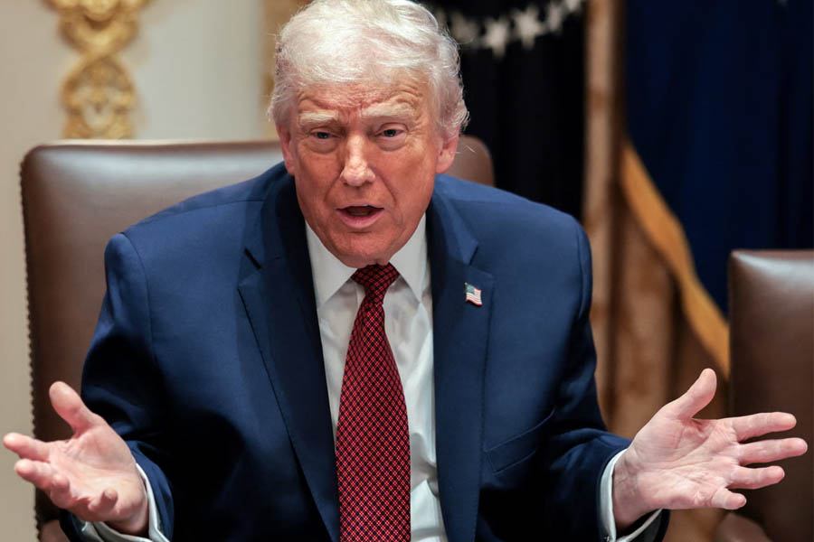 Donald Trump standing at the White House on Monday, speaking with halting remarks during a Politico interview and jumping between topics while echoing familiar grievances and conspiracies.