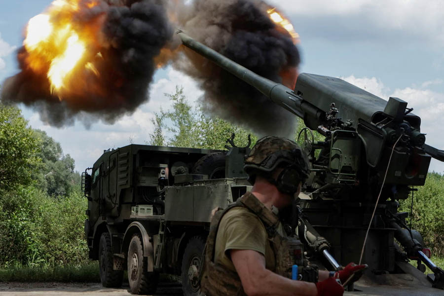 A Ukrainian soldier fires a self-propelled howitzer towards Russian troops near the frontline in the Kharkiv region.