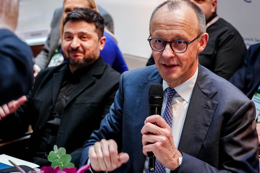 Ukrainian President Volodymyr Zelenskyy and German Chancellor Friedrich Merz speaking during a bilateral meeting at the Munich Security Conference, discussing European security and partnership-based leadership.