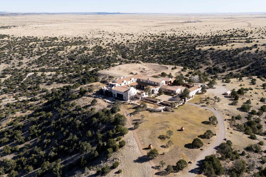 Drone view of Zorro Ranch, a large property near Stanley, New Mexico, previously owned by Jeffrey Epstein, showing the isolated estate and surrounding landscape.